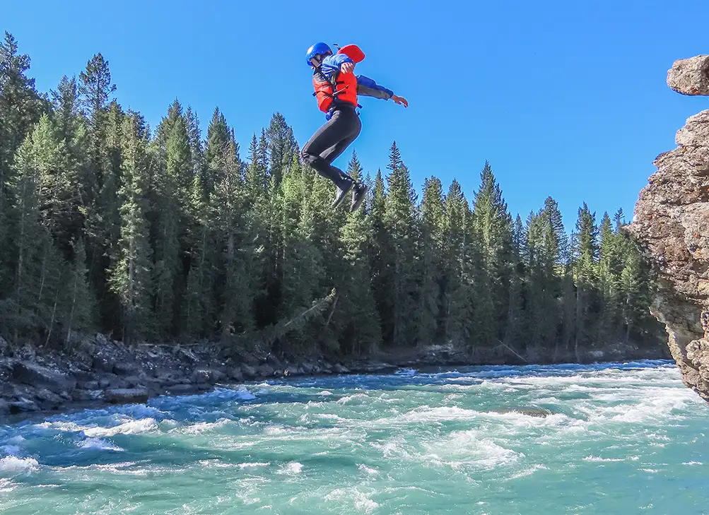 a man cliff jumping