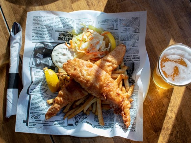 Battered fish and chips served with fries and coleslaw.  Accompanied with a fresh lemon wedge and tarter sauce.  A refreshing pint on the side.
A Family-friendly classic
