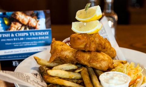 Fish and Chip special served with fries and coleslaw at the Georgetown Inn and Pub in Canmore, Alberta, their Tuesday dining special
