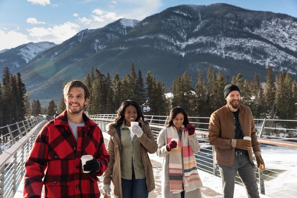 People walking the streets of Banff with a warm hot chocolate in their hands.