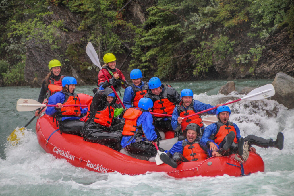 Rafters going through whitewater