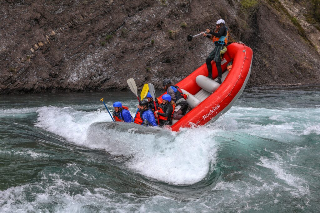 Surfing in a raft on the Kananaskis River with Canadian Rockies Rafting