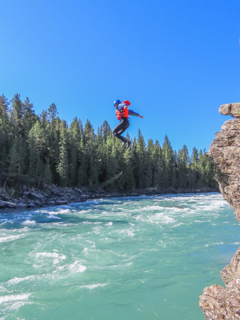 Cliff Jumping on the Bow River Horseshoe Canyon Tour with Canadian Rockies Rafting